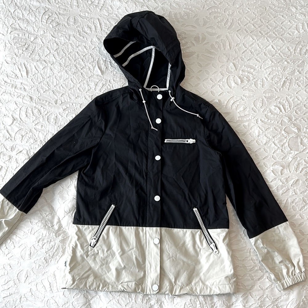 Levi’s raincoat, black and cream in color